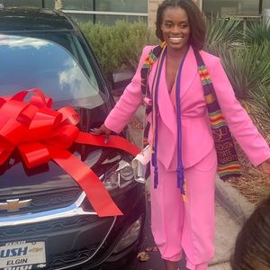 Two piece suit that comes with belt and ankle ties to produce the flared look